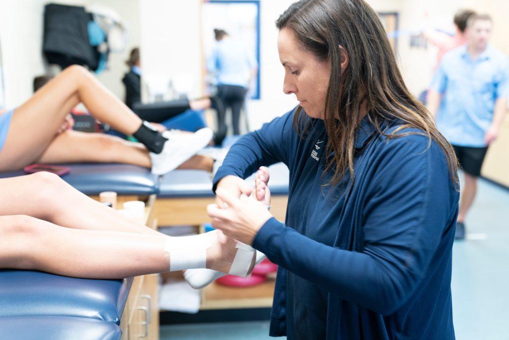 sports medicine at private high school in Tampa, ankle taping